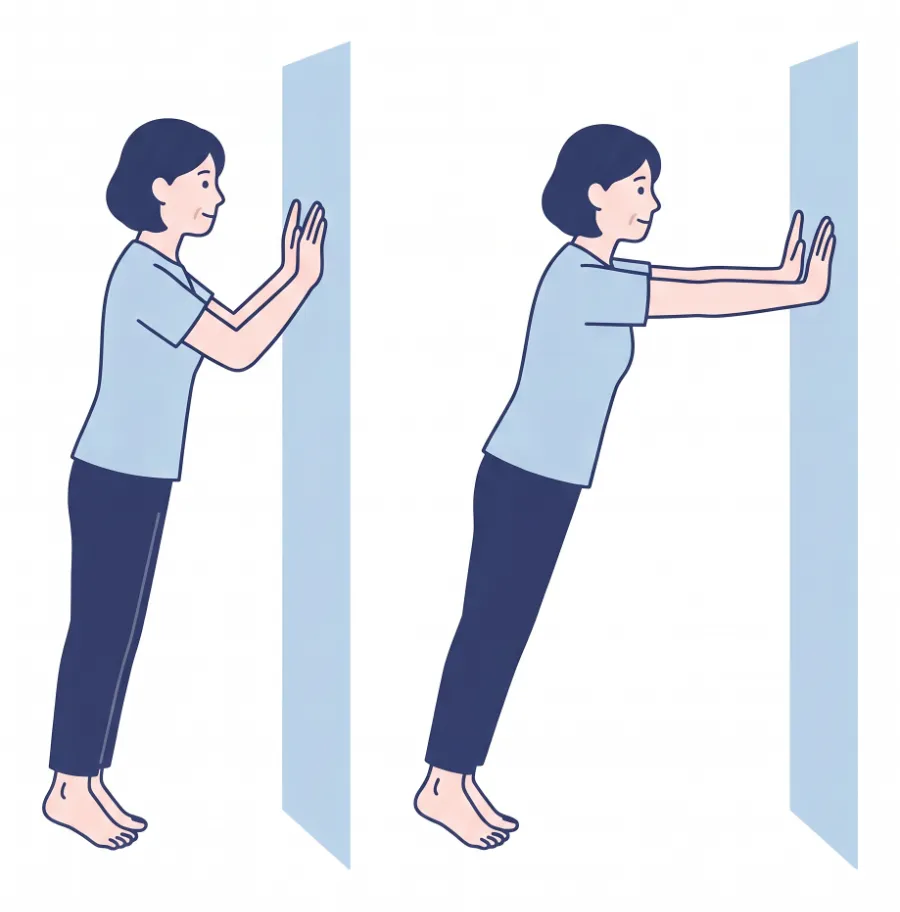 壁に両手をついて、ひじを曲げる姿勢と伸ばして押す姿勢（壁を使った腕立て）